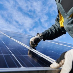 A person installing solar panels